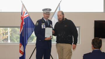 Riverina Police District Superintendent Andrew Spliet with Wagga man Wade Garland who helped fend off an attacker in Kooringal. Picture by Tom Dennis 